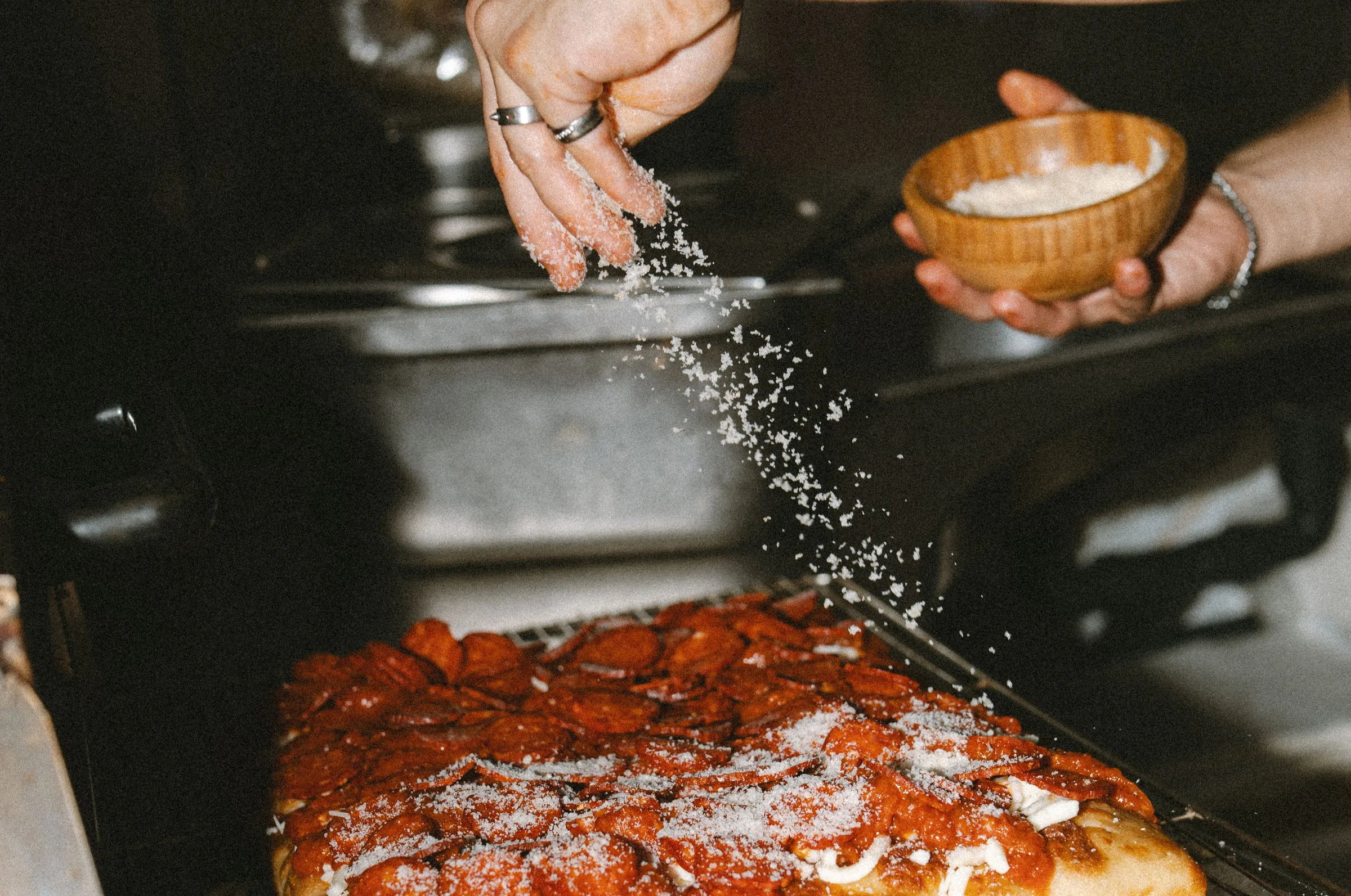 Fresh Detroit Style Pizza coming out of the oven at Pizza Yolo